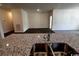 Gourmet kitchen with granite countertops overlooking the spacious living area at 623 Castillo Dr., Loris, SC 29569