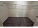 Spacious walk-in closet featuring neutral carpeting and wire shelving for optimal storage and organization at 623 Castillo Dr., Loris, SC 29569