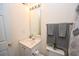 This bathroom features a vanity, toilet, decorative shower curtain, and gray towels at 100 Barnacle Ln. # S-4, Little River, SC 29566