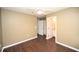 A spacious bedroom features a ceiling fan, hard wood floors, and has an ensuite bathroom at 100 Barnacle Ln. # S-4, Little River, SC 29566