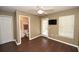 The bedroom has hard wood floors and includes a ceiling fan, television and access to the bathroom at 100 Barnacle Ln. # S-4, Little River, SC 29566