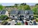 Inviting townhomes feature black shutters, gray roof, and well-maintained landscaping, with ample parking for residents and guests at 100 Barnacle Ln. # S-4, Little River, SC 29566