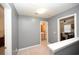 The second floor hallway provides access to the bedrooms and bathrooms at 100 Barnacle Ln. # S-4, Little River, SC 29566