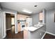 Well-lit kitchen features light wood cabinets, white appliances, and a convenient breakfast bar at 100 Barnacle Ln. # S-4, Little River, SC 29566