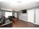 Relaxing living room with stylish ceiling fan, gray walls, dark wood floors, and ample natural light at 100 Barnacle Ln. # S-4, Little River, SC 29566