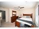 Main bedroom with wood furniture set, ceiling fan, and neutral carpeting at 100 Barnacle Ln. # S-4, Little River, SC 29566