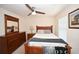 Comfortable main bedroom with a wood bed frame and matching furniture at 100 Barnacle Ln. # S-4, Little River, SC 29566