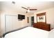 Main bedroom featuring neutral carpeting, a ceiling fan, and ample closet space at 100 Barnacle Ln. # S-4, Little River, SC 29566