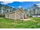 Home's backyard with green space and an extended outdoor deck, perfect for relaxing at 1390 Highway 129, Galivants Ferry, SC 29544