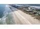 Aerial view of a beachfront condo complex, situated close to the ocean and nearby intercoastal waterway at 1501 S Waccamaw Dr. # 3-L, Murrells Inlet, SC 29576