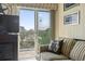 A cozy balcony with outdoor seating overlooking a neighborhood with coastal views at 1501 S Waccamaw Dr. # 3-L, Murrells Inlet, SC 29576