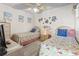 Charming bedroom with twin beds, beach-themed decor, and ample space for relaxing at 1501 S Waccamaw Dr. # 3-L, Murrells Inlet, SC 29576