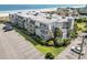 Aerial view of the condo complex, beach, and parking lot on a bright sunny day at 1501 S Waccamaw Dr. # 3-L, Murrells Inlet, SC 29576