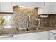 The kitchen sink has granite countertops, stainless steel appliances, and is well-lit at 1501 S Waccamaw Dr. # 3-L, Murrells Inlet, SC 29576
