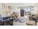 Cozy living room with starfish decor, comfortable seating, and a balcony offering beautiful views at 1501 S Waccamaw Dr. # 3-L, Murrells Inlet, SC 29576