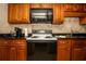 A lovely kitchen featuring wooden cabinets, granite countertops, coffee maker, and stainless steel microwave at 1501 South Ocean Blvd. # 738, Myrtle Beach, SC 29577