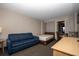 A cozy living room area with a couch, bed, wood table, and dining table with chairs at 1501 South Ocean Blvd. # 738, Myrtle Beach, SC 29577