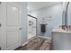 This bright bathroom features a marble-tiled shower with sleek black trim, and a modern vanity with a white countertop at 1612 Cosmos Lane, Myrtle Beach, SC 29577