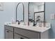This bright bathroom features a double vanity with modern fixtures, mirrors, and an elegant design with neutral tones at 1612 Cosmos Lane, Myrtle Beach, SC 29577