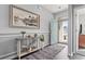 Welcoming entryway with a stylish console table, hardwood floors, and an inviting open door at 1612 Cosmos Lane, Myrtle Beach, SC 29577