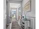 Elegant entryway featuring hardwood floors, console table and a serene view of the home's exterior at 1612 Cosmos Lane, Myrtle Beach, SC 29577