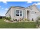 Charming single-Gathering home with well-manicured landscaping and a welcoming front entrance at 1612 Cosmos Lane, Myrtle Beach, SC 29577