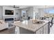 Open kitchen and living area showcasing granite countertops, a cozy seating area, and a fireplace at 1612 Cosmos Lane, Myrtle Beach, SC 29577