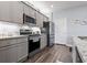 Modern kitchen with stainless steel appliances, granite countertops, and stylish cabinetry at 1612 Cosmos Lane, Myrtle Beach, SC 29577