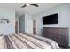 This main bedroom features neutral tones, a large window, and an en suite bathroom with stainless steel fixtures at 1612 Cosmos Lane, Myrtle Beach, SC 29577