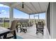 Relaxing screened-in patio with comfortable seating and views of the backyard, perfect for outdoor living at 1612 Cosmos Lane, Myrtle Beach, SC 29577