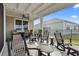 Spacious covered patio, ideal for outdoor gatherings, featuring a ceiling fan and comfortable seating at 1612 Cosmos Lane, Myrtle Beach, SC 29577