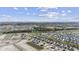 Picturesque aerial view of the community showcasing well-planned streets, ponds, and distant ocean views at 231 Broughton Dr., Myrtle Beach, SC 29579
