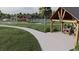 Community green space with covered picnic tables, tennis court and walking paths at 231 Broughton Dr., Myrtle Beach, SC 29579