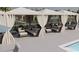 Poolside cabana with comfortable seating provides shade and relaxation for residents at 231 Broughton Dr., Myrtle Beach, SC 29579
