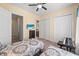 Cozy bedroom featuring two beds with patterned comforters, a ceiling fan, and an en-suite bathroom at 2790 Howard Ave. # D, Myrtle Beach, SC 29577