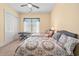 Bedroom featuring two comfortable beds, a ceiling fan, and a window with privacy blinds at 2790 Howard Ave. # D, Myrtle Beach, SC 29577