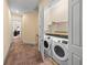 Hallway laundry closet with a side-by-side washer and dryer at 2790 Howard Ave. # D, Myrtle Beach, SC 29577