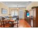 Open-concept living space with hardwood floors, dining area, and comfortable seating, ideal for entertaining at 2790 Howard Ave. # D, Myrtle Beach, SC 29577