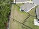Aerial view of fenced backyard with green grass and mature trees at 2904 Lunar Ct., Myrtle Beach, SC 29577