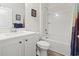 Clean and functional bathroom featuring a single sink vanity, toilet, and a shower-tub combination with white tile surround at 2904 Lunar Ct., Myrtle Beach, SC 29577