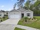 Charming single-story home with well-manicured lawn and attached garage at 2904 Lunar Ct., Myrtle Beach, SC 29577