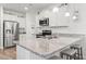 Kitchen island with granite countertops, stainless steel appliances, ample counter space and bar stool seating at 2904 Lunar Ct., Myrtle Beach, SC 29577