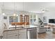 Open-concept kitchen with granite countertops, stainless steel appliances and a view to the dining and living room at 2904 Lunar Ct., Myrtle Beach, SC 29577