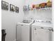 Well-equipped laundry room with a washer and dryer, ample shelving for storage, and neutral decor for a tidy space at 2904 Lunar Ct., Myrtle Beach, SC 29577