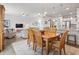 Open concept living area with kitchen, dining, and living rooms with abundant natural light at 2904 Lunar Ct., Myrtle Beach, SC 29577