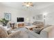 Bright living room featuring neutral tones, a ceiling fan, and comfortable seating arrangement at 2904 Lunar Ct., Myrtle Beach, SC 29577