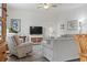 Cozy living room with a ceiling fan, comfortable seating and built in shelving at 2904 Lunar Ct., Myrtle Beach, SC 29577