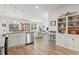 Open-concept living space featuring bright white cabinetry and eat-in dining area at 2904 Lunar Ct., Myrtle Beach, SC 29577