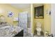 Well-lit bathroom featuring a spacious vanity, a shower with a colorful curtain, and a modern toilet at 308 36Th Ave. N, North Myrtle Beach, SC 29582