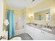Bright bathroom with a double sink vanity, granite countertops, and a shower-tub combination at 308 36Th Ave. N, North Myrtle Beach, SC 29582